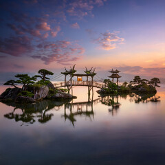 Aufkleber - Serene landscape featuring a bridge and island at sunset