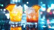 © tea - Refreshing Cocktails in the Rain - Two iced cocktails, one orange and one red, garnished with orange slices, sit on a rain-slicked surface under a night sky