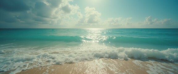 Poster - Turquoise waves meet sandy beach under a cloudy sky in a stunning ocean landscape