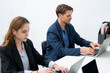© Hip.hub - Professionals engaged in collaborative work at a modern office during daytime