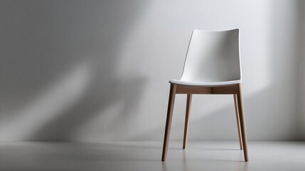 Poster - Minimalist white chair with wooden legs against a textured white wall casting shadows creating a serene and modern interior design scene