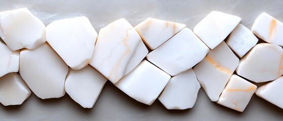 Leinwandbilder - Abstract arrangement of irregular white stone pieces with subtle orange veining on a neutral grey background creating a mosaic-like pattern. Minimalist aesthetic highlights textures and forms