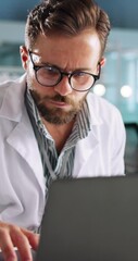 Poster - Medical, man and laptop in lab with tablet, research and smile for problem solving. Science engineer, tech and typing in office for result comparison, innovation or planning investigation with scroll