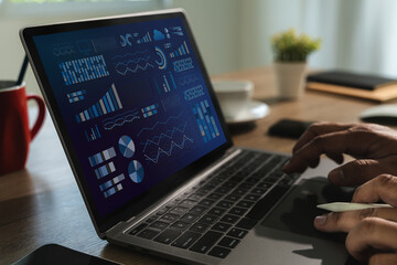 Poster - The business analyst used a laptop to analyze financial statistics, creating a digital dashboard for marketing performance reports..