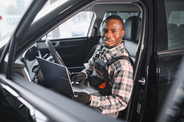 Poster - Automobile computer diagnosis. Car mechanic repairer looks for engine failure