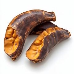Poster - Sliced Tamarind showcasing their wrinkled textures and vibrant color contrasts against a clean white backdrop. Sliced Tamarind Isolated on a white background.