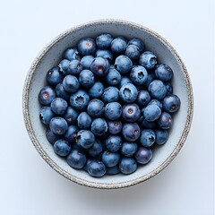 Poster - A rustic bowl brimming with Blueberry, juicy blueberries. A summery, healthy treat. Blueberry Isolated on a white background. Bowl of Fresh Blueberries: A Delightful Summer Treat