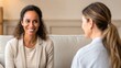 © Stick Stack Stock - Mental Health Support and Selfcare Therapy, Two women in a friendly conversation, one smiling warmly, creating a welcoming atmosphere.