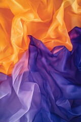 Poster - Abstract flowing silk fabric in vibrant orange and purple hues creating a dynamic and colorful texture background showcasing soft light and shadow interplay with a top down view