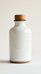 Poster - Minimalist ceramic bottle with wooden stopper on white background studio shot for product presentation
