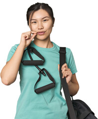 chinese athlete using resistance bands with fingers on lips keeping a secret.