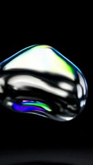 Poster - Dynamic transformation of metallic iridescent liquid shape on black background