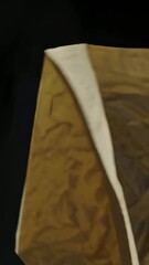 Poster - Abstract movement of crumpled paper against dark background capturing texture and light dynamics