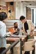 © Bliss - Collaboration and creativity flourish in a modern office environment during a vibrant workday