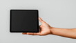 © NAD SANG PAP - hand holding thin tablet with blank screen, showcasing modern technology and digital communication