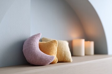 Poster - cozy children room featuring nightlight shaped like moon and tactile soft toys