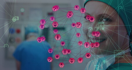Poster - Image of network of connections with icons over smiling caucasian female surgeon