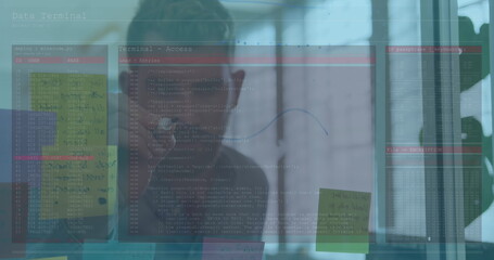 Poster - Image of data processing over caucasian businessman taking notes