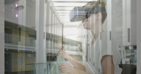 Poster - Image of women using vr headset over server room