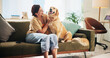 © peopleimages.com - Woman, golden retriever and play on sofa in home, smile and bonding in morning for love in living room. Excited girl, dog mom and pet animal with embrace, touch and loyalty with stroke at apartment