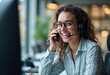 © Kawsar - Businesswoman in headset smiling during remote meeting