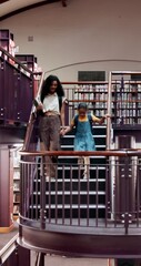 Poster - Woman, child and walking with books in library for information, learning and academic knowledge. Tutor, student and holding hands with education for resources, project research and homework on stairs
