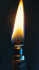 Poster - A close-up shot of a lighter on a dark background, perfect for use in scenes where light is needed.