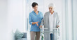 © peopleimages.com - Help, caregiver and old woman with walker in home for healthcare, physio or support in retirement. Senior care, physiotherapist and elderly person with walking frame for mobility exercise in recovery