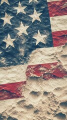 Wall Mural - a close-up shot of an american flag buried in sandy beach, with sun and sky in the background.