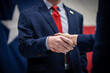 © Lone Star Stock - Male and Female Business Professionals or Politicians In Suits Shaking Hands In Front of the Texas Flag Close Up