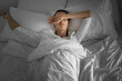 © kieferpix - Woman waking up tired having bad night sleep