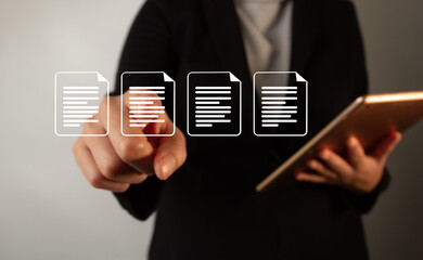 Poster - A businesswoman points to a series of document icons. She holds a tablet in her hand.