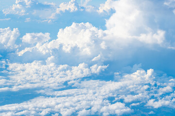 Wall Mural - blue sky with a clouds. Clear blue sky panoramic background with small white clouds. Partly cloudy. White fluffy clouds in the blue sky.
