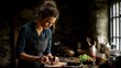 © PennHelen - Authentic lifestyle shot of a woman cooking a meal in a rustic kitchen, natural lighting