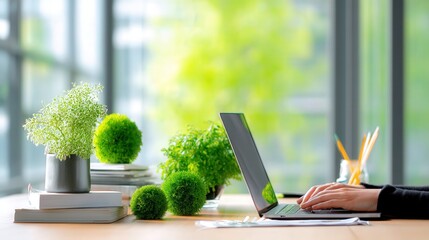 Poster - Individual working diligently on a laptop in a modern workspace surrounded by creativity and productivity