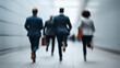 © pattozher - Hustle and Ambition: A dynamic shot captures a group of business professionals sprinting forward with purpose through a modern, abstract corridor. A visual narrative that represents urgency, drive.