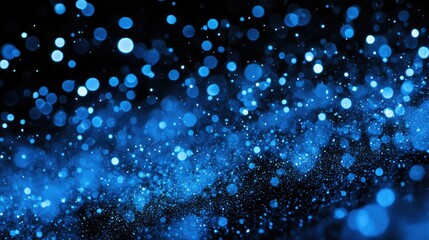 Poster - Vibrant Blue Bokeh Effect Creating a Dreamlike Abstract Background with Sparkling Particles in a Dark Setting for Artistic and Design Projects