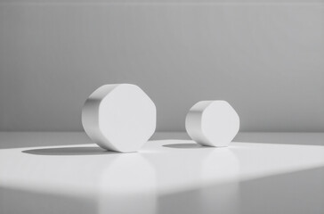Leinwandbilder - Two white octagonal shapes, different sizes, sit on a reflective surface.  Sunlight casts shadows, creating a minimalist, clean aesthetic.