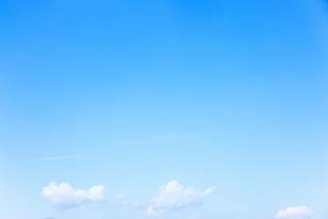 Wall Mural - fantastic soft white clouds against blue sky and copy space horizontal shape