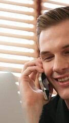 Poster - Happy businessman or salesman doing online business, remote working with laptop and making phone calls for sales at home. Telesales and modern business with communication. Adit
