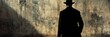 © najib - Mystery Man Silhouette Against an Old Grunge Textured Concrete Wall