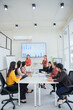 © aekachai - Group of business people meet to discuss and present their work at the office.