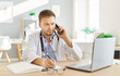 © Studio Romantic - Male serious doctor, nurse man talking to patient on mobile phone in office, using laptop at workplace, telling, giving healthcare checkup test results, diagnose news, communication with physician