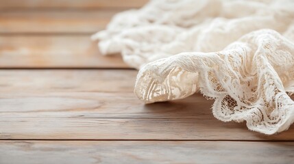 Poster - Elegant white lace fabric draped artistically on weathered wooden table creating a soft and dreamy aesthetic : Generative AI