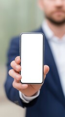 Poster - Businessman holding smartphone with blank screen in modern office environment showcasing technology and communication innovation concept