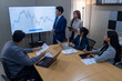 © Freeday photo - Team meeting in a modern office discussing financial trends and data analysis during the day