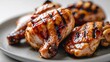 © Den Boro Day - Close up of grilled chicken pieces showing grill marks and glossy glaze