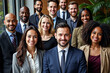 © Creuxnoir - Group portrait of a diverse group of people, all dressed in formal business attire.