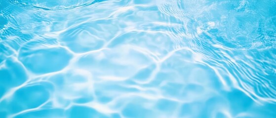 Poster - A tranquil image of shimmering blue water, capturing the gentle ripples and reflections on the surface.