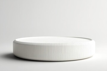 Poster - Minimalist round white table with textured surface in a modern interior setting